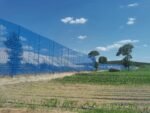 CORRUGATED WINDBREAK FENCE